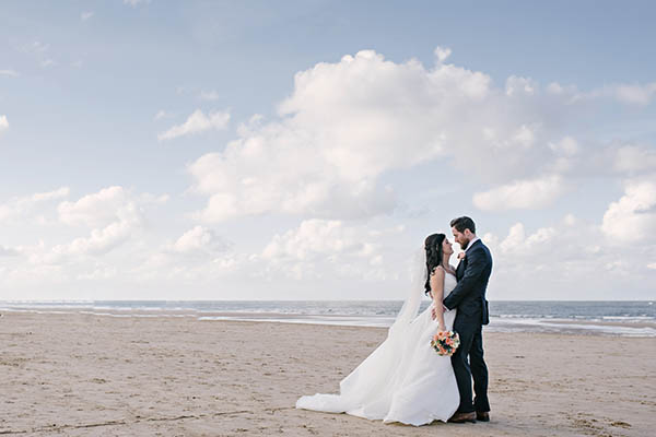 Louise and Gary celebrated their marriage with a beach wedding, with the bride wearing Mori Lee and the couple choosing romantic but pared back decor...